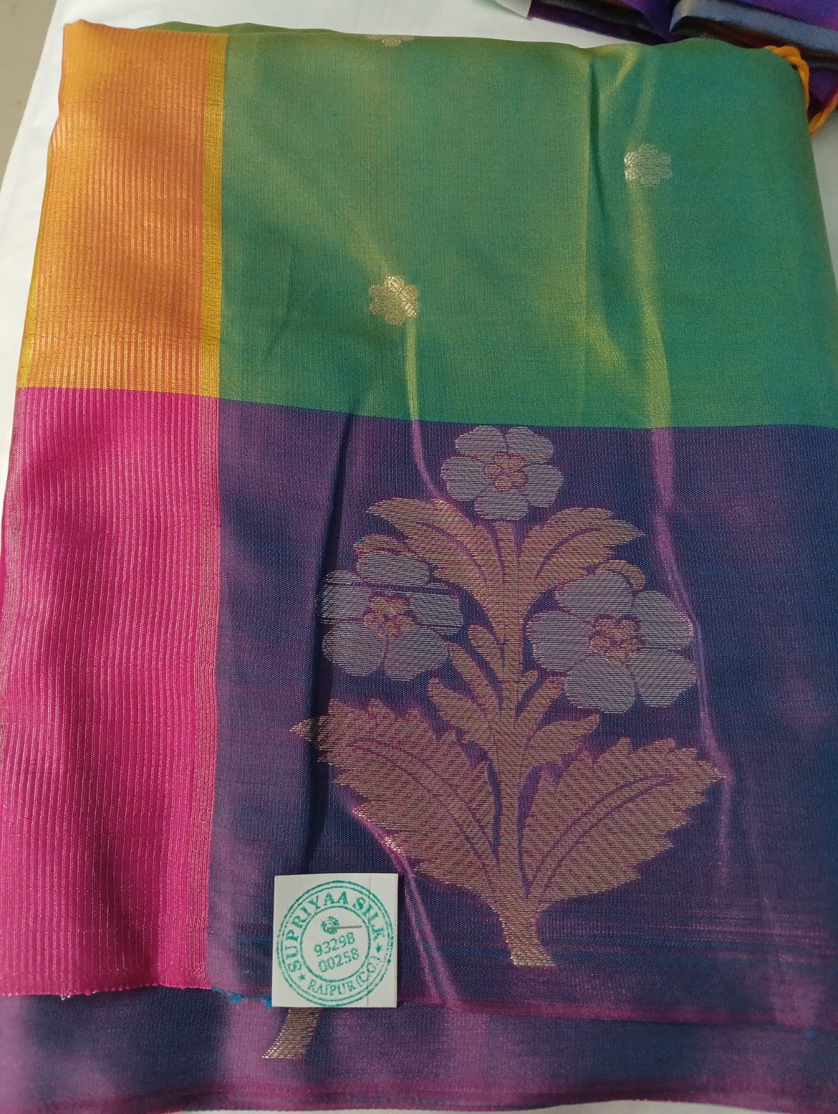 WhatsApp Image 2026-07-14 at 5.45.28 PM - Copy Semi Muga Silk Kanchipuram Saree with Silver Zari Floral Motifs – Green Purple | Supriyaa Silk - Image 1